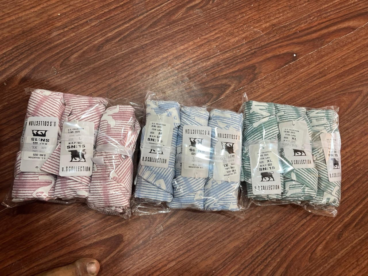 Men's pastel abstract line-print shirts in pink, blue, and green